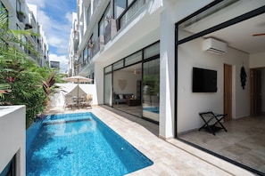 Relaxing seating area on the patio by the pool.