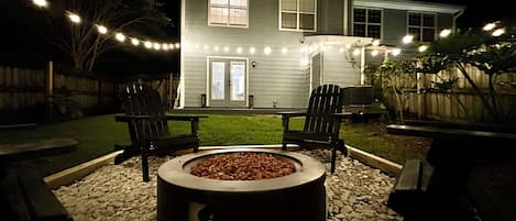 Lovely ambient lighting | String lights | Fire pit with outdoor sitting | Private Backyard
