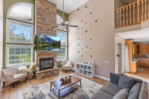 Open-Concept Living Room with Unique Rock Climbing Wall