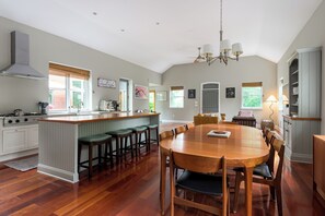 Gather, cook, and connect - this bright open-concept space blends classic charm with modern comfort, perfect for everything from slow mornings to celebratory dinners.