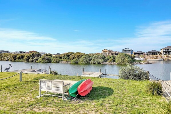 Kayaks are included in your stay, while bench seating beside the water offers an idyllic spot to unwind with a book.
