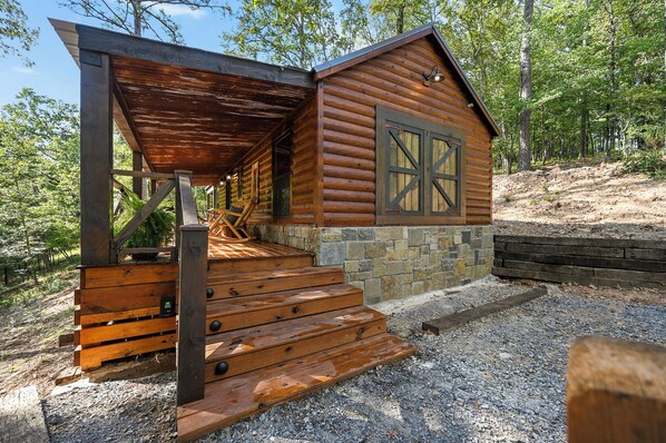 Rustic log cabin retreat with natural charm and forest vibes in Broken Bow, OK.