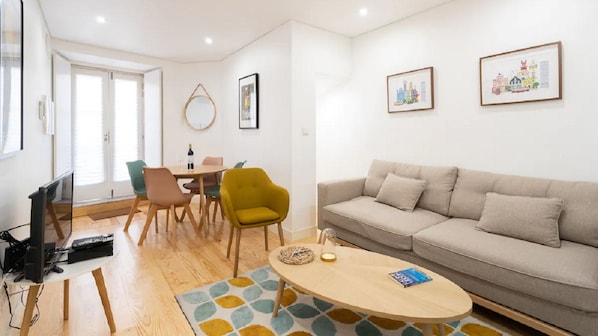Full of natural light, the bright living room welcomes you as soon as you walk up the stairs #bright #welcoming #portugal #pt #lisbon