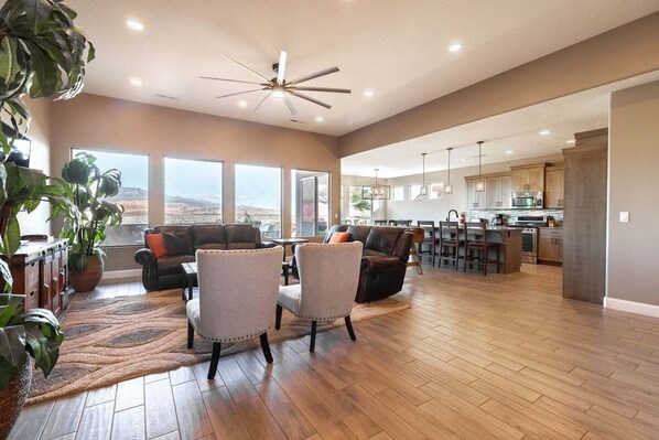 Living Room/Kitchen area boasts wide open space perfect for family and friends to gather.