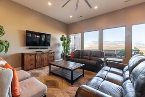 Comfortable living room space with picturesque mountain views.