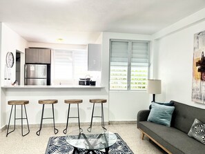 Living room overlooks the kitchen.