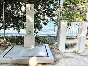 Outdoor shower before the private beach.