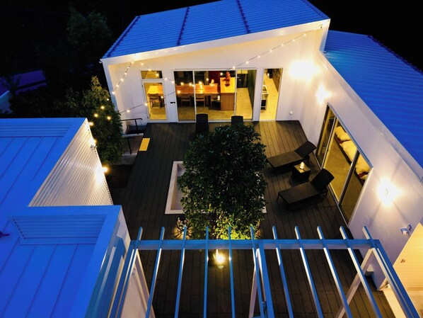 A wooden deck where you can enjoy the night illumination