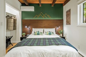 Bedroom 1 features a queen bed.