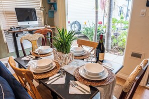 Dinning table seat 4 with view of the front yard Garden.
