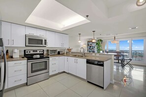 The sparkly kitchen has everything needed to prepare a meal at home