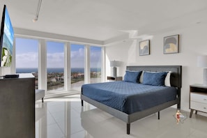 Bedroom 1 has a king-size bed and access to the balcony