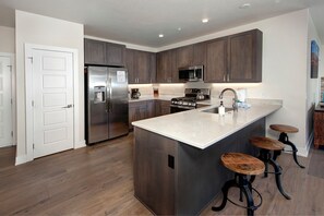 Gorgeous kitchen with stainless steel appliances. Fully stocked with everything to make delicious meals for the whole family!