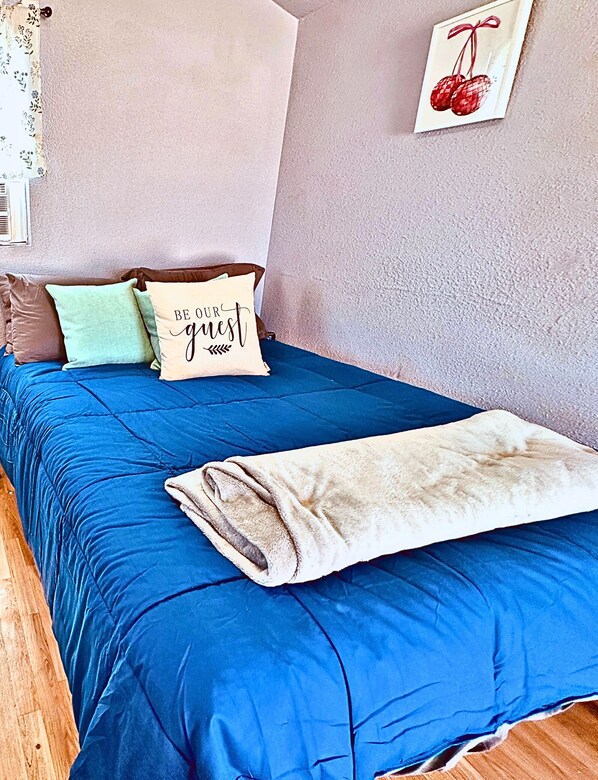 A comfortable bed and a clean space make for the perfect getaway.