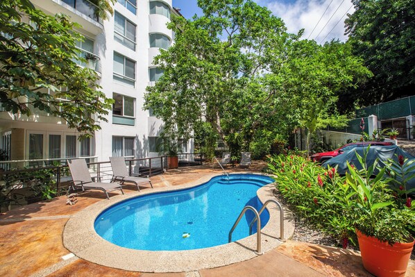 Shared Pool Oasis – Cool off in the refreshing shared pool, surrounded by lush tropical landscaping.