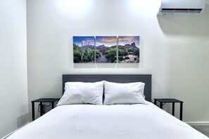Each home has a Queen size bed with nightstands and lighting.
