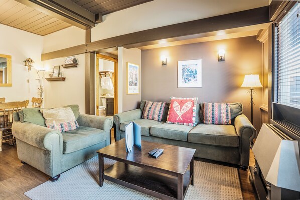 Master bedroom and main bathroom are located behind the living room area.