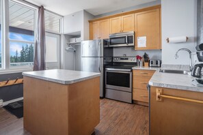 Front door entrance is located to the left of the kitchen.