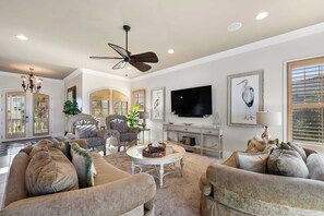 Step into luxurious living with expansive windows and plush seating—bask in natural light while relaxing in style.