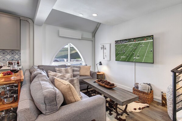 Blue Church Lodge C offers a stylish, cozy living room with flat screen TV.