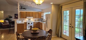Updated appliances, eat-in lakeview dining table. Outdoor seating and gas grill