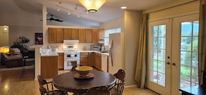 Updated appliances, eat-in lakeview dining table. Outdoor seating and gas grill