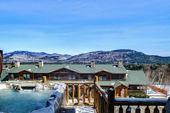 Soak in the private hot tub on the deck, with mountain and trail views.