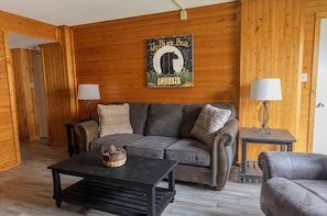 The living room has a sleeper sofa that accommodates two additional people.