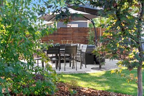 Spend time outside barbecuing, sipping cocktails, and relaxing by the firepit. 