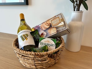 Waiting in your room is a bottle of wine, cheese and brioche crackers and some of our favorite local chocolates.