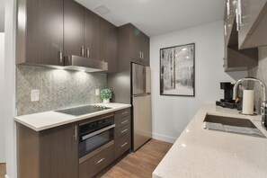 This floor plan has a large full kitchen separated from the living space
