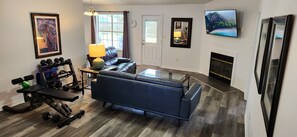 Relax on a leather couch or reclining loveseat & enjoy movies on a 60" smart TV
