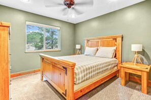 Ground floor bedroom with one queen bed