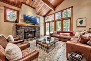 Our large "great room" evokes a mountain lodge feel with a large leather sectional and gas fireplace.