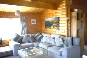 Sitting area with large corner sofa and coffee table