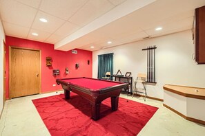 Fun game room with a full size billiards table, ready for friendly competitions.