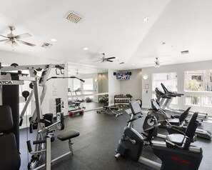 Stay energized in the communal fitness center, featuring a range of workout machines and free weights to help you maintain your fitness routine during your getaway!