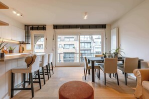 Bright and modern living area with direct access to the balcony