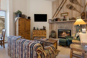 Curl up on the cozy sofa and enjoy the gas fireplace