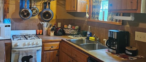 Kitchen with all the essentials. Coffee, sugar, and creamer provided.