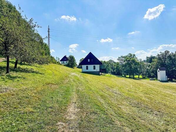Cloud, Sky, Plant, Building, Natural Landscape, Tree, Highland, Slope, Land Lot, House