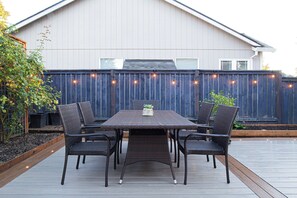 Enjoy outdoor dining on the spacious 20x22ft deck that overlooks the backyard
