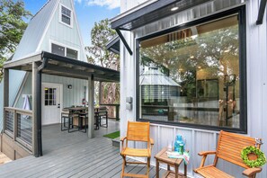 Open concept outdoor entertainment area between units