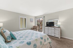 King master bedroom with bath and door to balcony