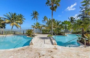 Our outdoor space is a true tropical escape, with comfortable seating and exotic plants. It's the ideal spot to soak up the sun and enjoy the island breeze.