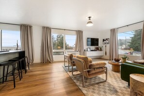 So Many Windows in the Open Living Room/Kitchen