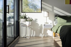 Bright & Breezy with a View 🌅✨ Start your day with stunning outdoor views right from your bed. The large window fills the space with sunshine, creating a fresh and airy atmosphere—perfect for a relaxing getaway.