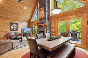 Wall of Windows, Vaulted Ceilings and Stacked Stone Fireplace to Enjoy