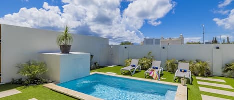 Relax and soak up the sun in your private pool area—perfect for a refreshing swim or lounging in style.