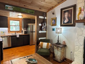 Cozy corner with surrounded by the homeowner's artwork. 